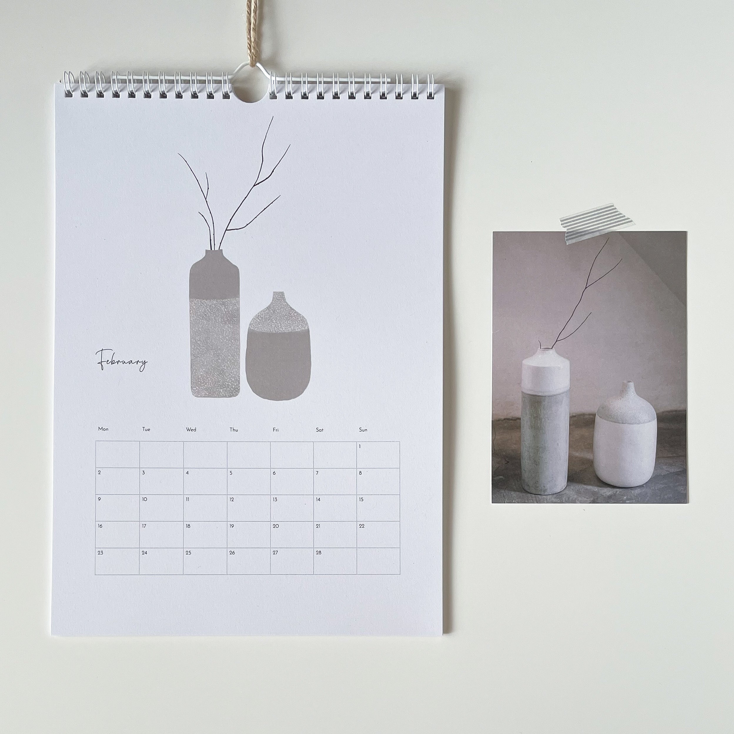 Calendar with a design of vases and branches on a light background