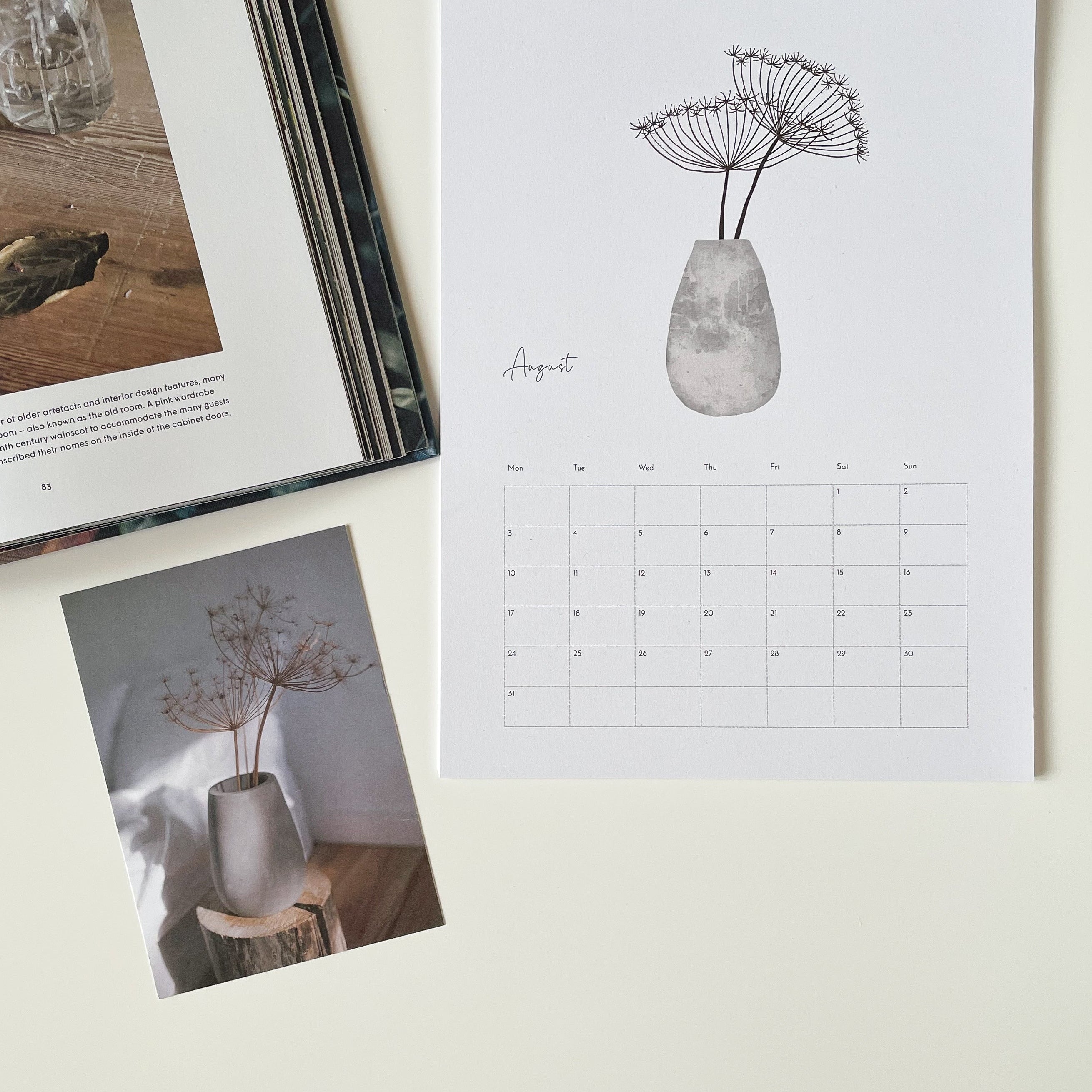 Calendar with floral design and matching photo on a light surface