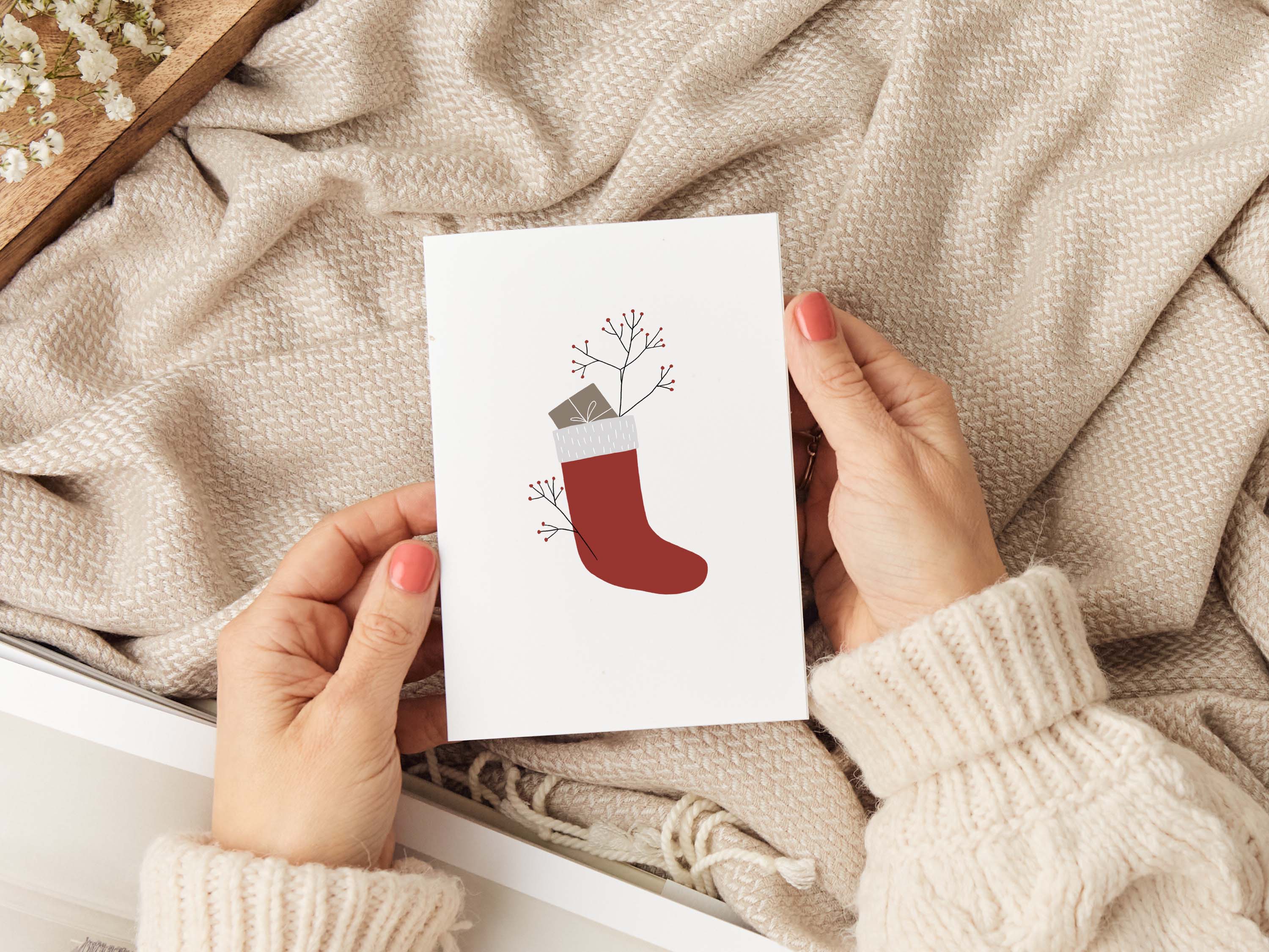 Modern Christmas greeting card illustrated Christmas sock with gift