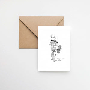 A girl on a bicycle with hat and a basket of flowers black and white postcard elemente design